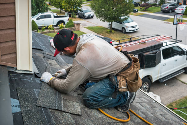 Professional Roofing technician working in Apulia Station, NY